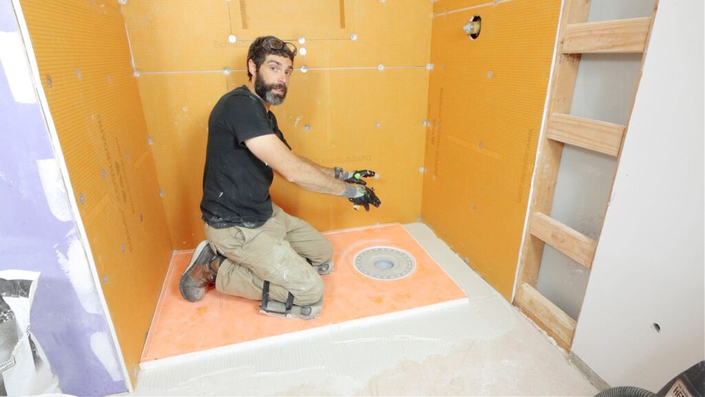 Shower tray installation team at work